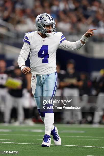 Dak Prescott of the Dallas Cowboys celebrates a touchdown run by Ezekiel Elliott during the second quarter against the Atlanta Falcons at AT&T...
