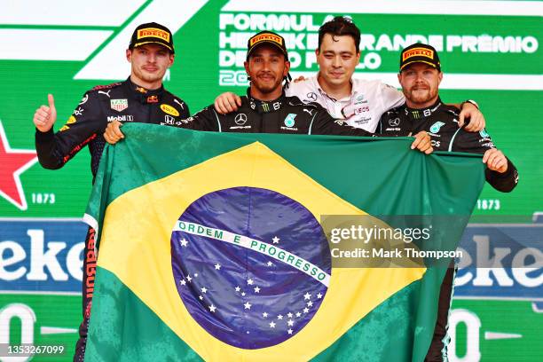 Race winner Lewis Hamilton of Great Britain and Mercedes GP, second placed Max Verstappen of Netherlands and Red Bull Racing and third placed...