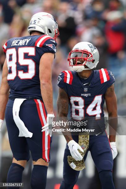 Kendrick Bourne of the New England Patriots celebrates with Hunter Henry after scoring a touchdown against the Cleveland Browns during the second...