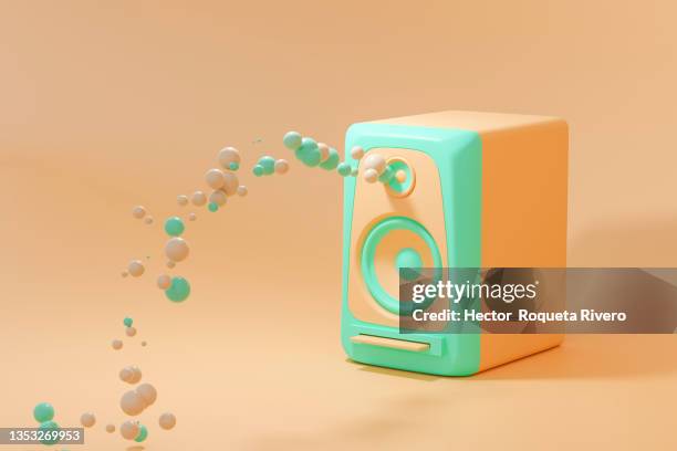 3d render of speaker pulling out orange and green spheres in pastel tones background - radio dj photos et images de collection