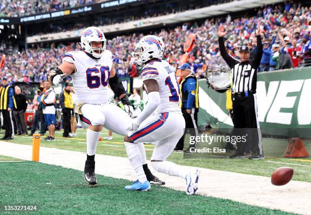 Mitch Morse of the Buffalo Bills congratulates Stefon Diggs after his touchdown in the second quarter against the New York Jets at MetLife Stadium on...