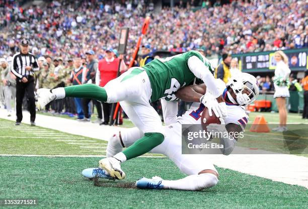 Stefon Diggs of the Buffalo Bills catches a touchdown pass as Javelin Guidry of the New York Jets defends during the second quarter at MetLife...