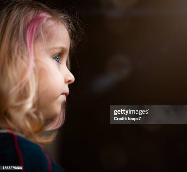sad little blue eyes girl - autismus stock pictures, royalty-free photos & images