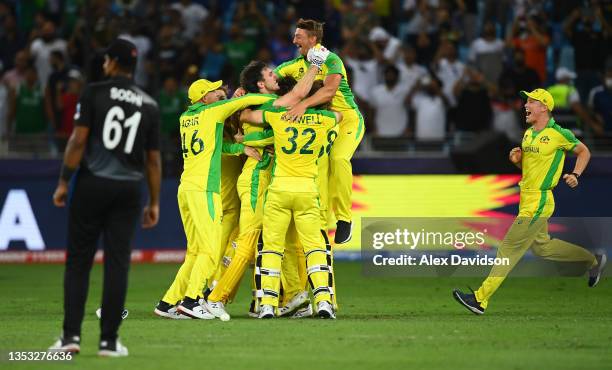Australia players celebrate following the ICC Men's T20 World Cup final match between New Zealand and Australia at Dubai International Stadium on...