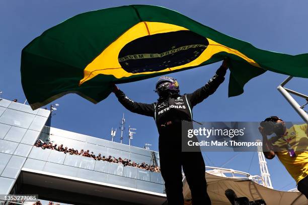 Race winner Lewis Hamilton of Great Britain and Mercedes GP celebrates in parc ferme during the F1 Grand Prix of Brazil at Autodromo Jose Carlos Pace...