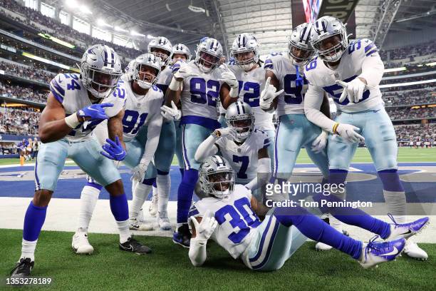 The Dallas Cowboys celebrate an interception by Trevon Diggs of the Dallas Cowboys against the Atlanta Falcons during the third quarter at AT&T...