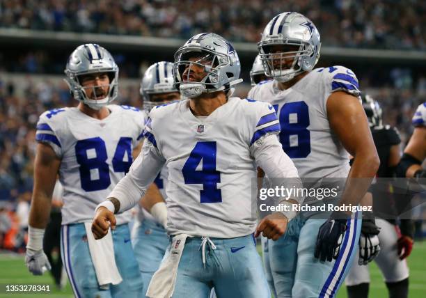 Dak Prescott of the Dallas Cowboys celebrates his rushing touchdown against the Atlanta Falcons during the third quarter at AT&T Stadium on November...