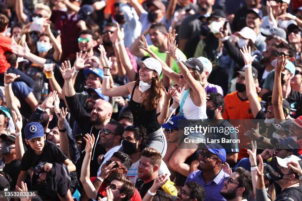 Fans run onto the track to enjoy the podium celebrations during the F1 Grand Prix of Brazil at Autodromo Jose Carlos Pace on November 14, 2021 in Sao...