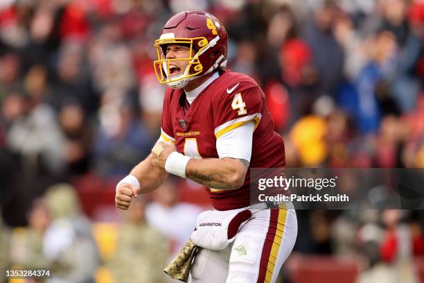 Taylor Heinicke of the Washington Football Team celebrates a touchdown during the fourth quarter against the Tampa Bay Buccaneers at FedExField on...