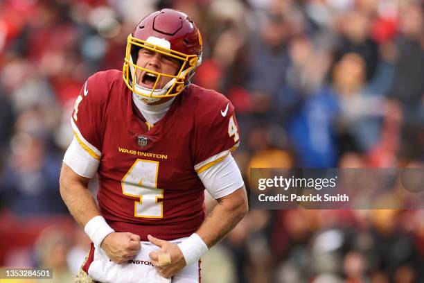 Taylor Heinicke of the Washington Football Team celebrates a touchdown during the fourth quarter against the Tampa Bay Buccaneers at FedExField on...