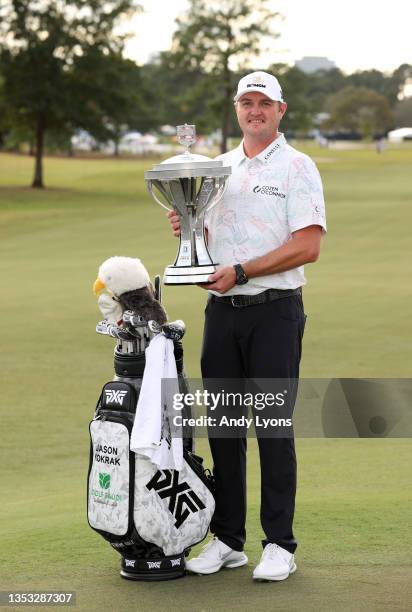 Jason Kokrak poses with the trophy after putting in to win on the 18th green during the final round of the Hewlett Packard Enterprise Houston Open at...