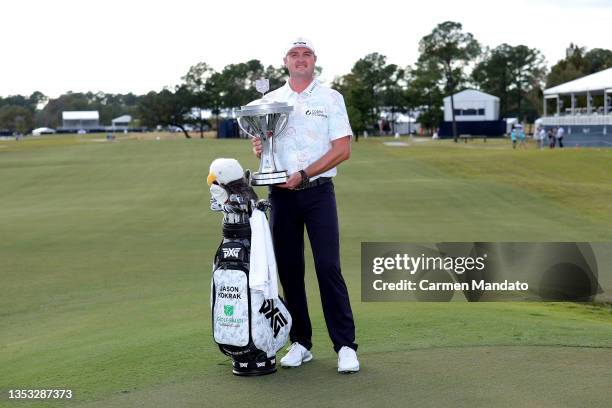 Jason Kokrak poses with the trophy after putting in to win on the 18th green during the final round of the Hewlett Packard Enterprise Houston Open at...