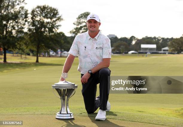 Jason Kokrak poses with the trophy after putting in to win on the 18th green during the final round of the Hewlett Packard Enterprise Houston Open at...