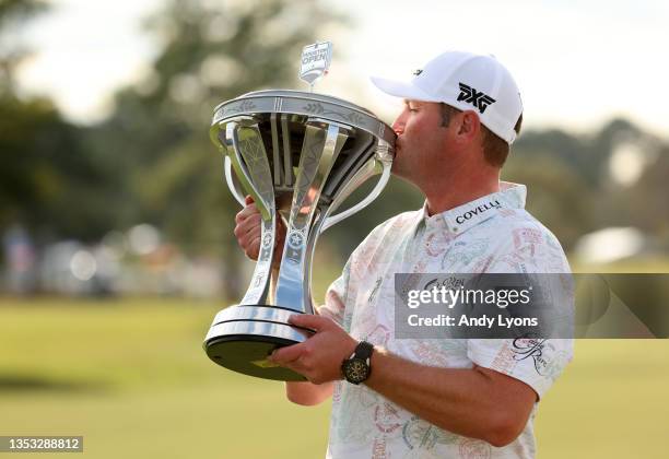 Jason Kokrak poses with the trophy after putting in to win on the 18th green during the final round of the Hewlett Packard Enterprise Houston Open at...