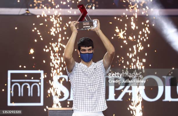 Carlos Alcaraz of Spain celebrates with the trophy after his win over Sebastian Korda of USA in the final match during Day Five of the Next Gen ATP...