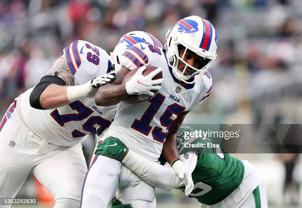 Isaiah McKenzie of the Buffalo Bills carries the ball as Sharrod Neasman of the New York Jets defends in the fourth quarter at MetLife Stadium on...