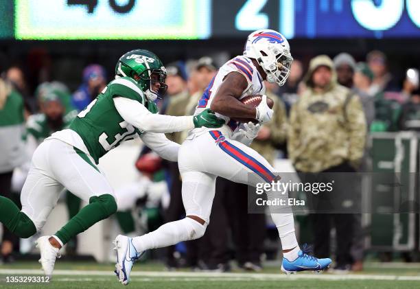 Stefon Diggs of the Buffalo Bills catches a pass while Sharrod Neasman of the New York Jets defends during the fourth quarter at MetLife Stadium on...