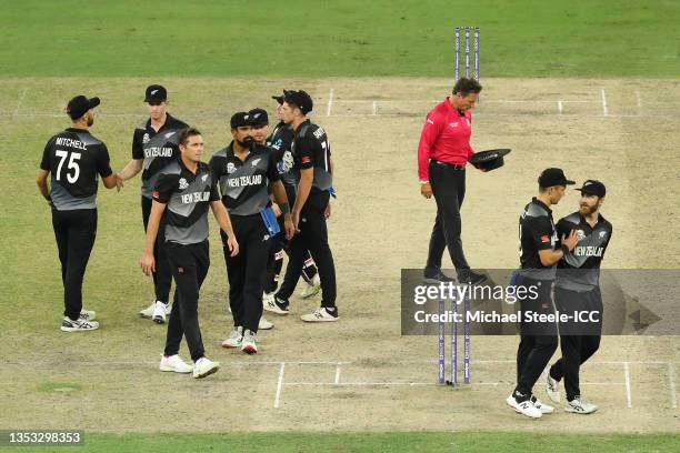 Trent Boult of New Zealand shows his support to captain Kane Williamson following their side's defeat during the ICC Men's T20 World Cup final match...