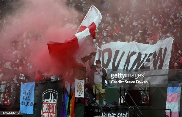 Portland Thorns FC fans light a smoke bomb as part of a protest of the sex scandal in the NWSL during the first half of the match between the...