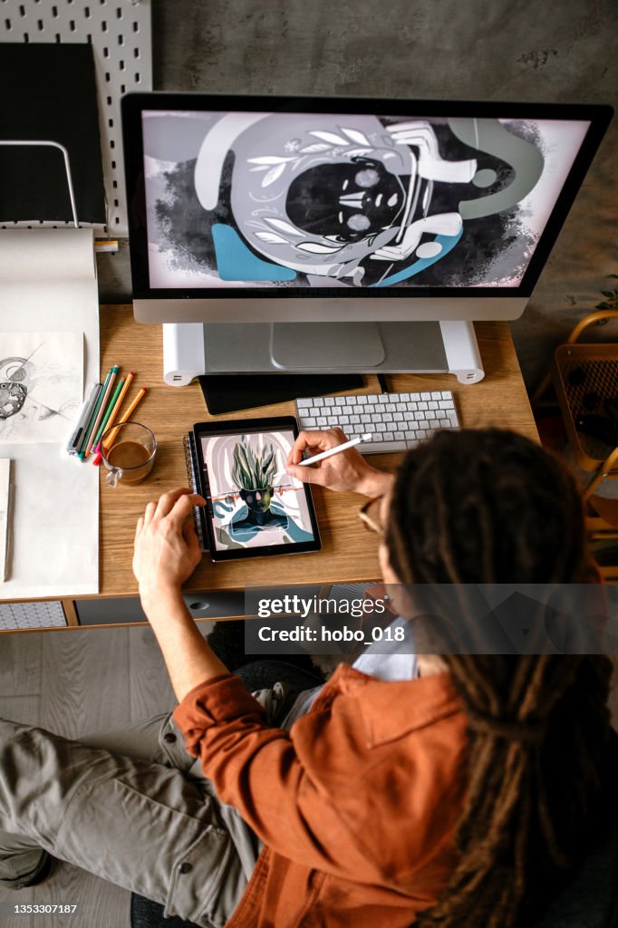 Designer Using Tablet Creative Graphic Designer Using Digital Tablet And Computer Creating ...