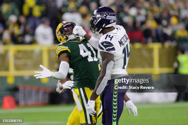 Henry Black of the Green Bay Packers and DK Metcalf of the Seattle Seahawks get into an altercation during the fourth quarter at Lambeau Field on...