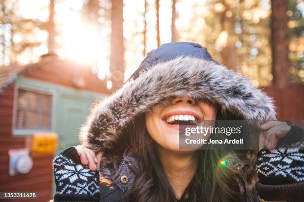 woman smiling winter outdoors - fingerless gloves stock-fotos und bilder