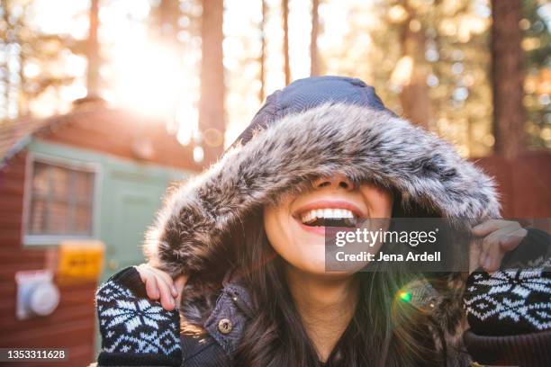 woman smiling winter outdoors - fingerless glove stock pictures, royalty-free photos & images