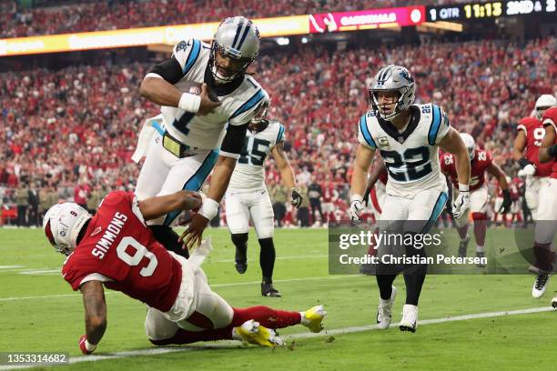 Quarterback Cam Newton of the Carolina Panthers scores on a 2-yard rushing touchdown against inside linebacker Isaiah Simmons of the Arizona...