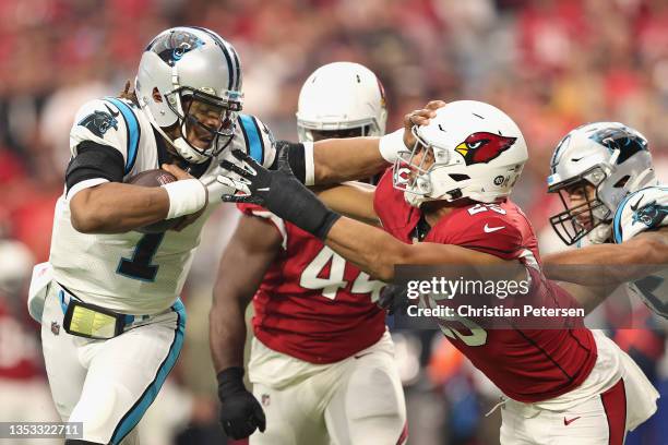 Quarterback Cam Newton of the Carolina Panthers rushes the football for a touchdown against inside linebacker Zaven Collins of the Arizona Cardinals...