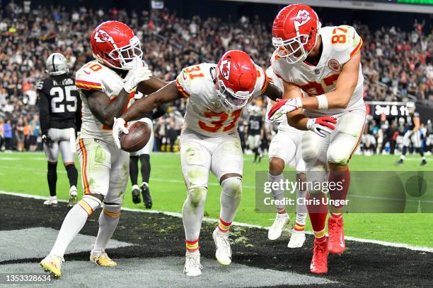 Darrel Williams celebrates after scoring a touchdown with teammates Travis Kelce and Tyreek Hill of the Kansas City Chiefs during the second half in...