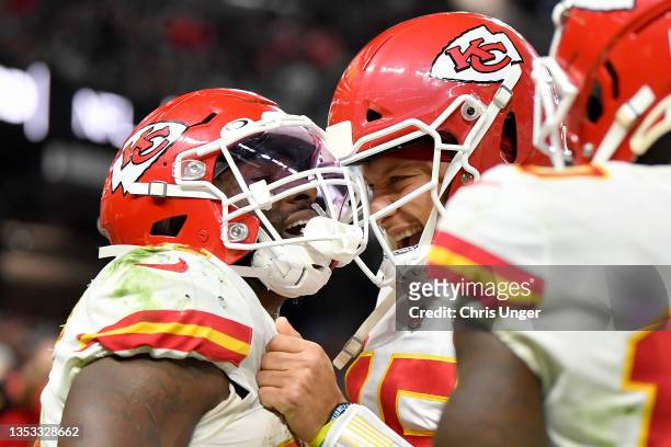 Darrel Williams celebrates after scoring a touchdown with teammate Patrick Mahomes of the Kansas City Chiefs during the second half in the game...