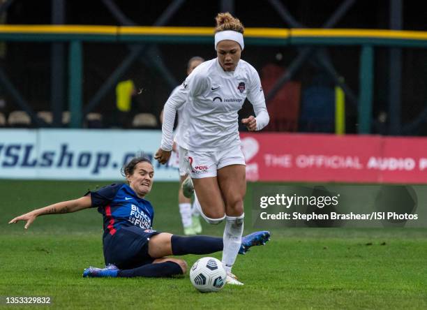 Trinity Rodman of the Washington Spirit avoids the tackle of Dzsenifer Marozsán of OL Reign during a game between Washington Spirit and OL Reign at...