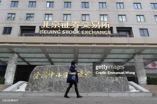 Person walks passed the Beijing Stock Exchange on November 15, 2021 in Beijing, China.