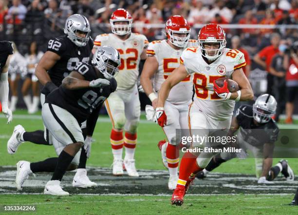 Tight end Travis Kelce of the Kansas City Chiefs runs after a catch against defensive tackle Johnathan Hankins of the Las Vegas Raiders during their...
