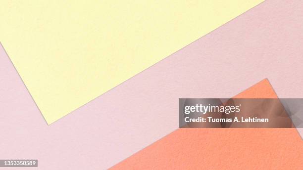 pastel colored papers in abstract geometric pattern, top view. - pastel colored stock-fotos und bilder