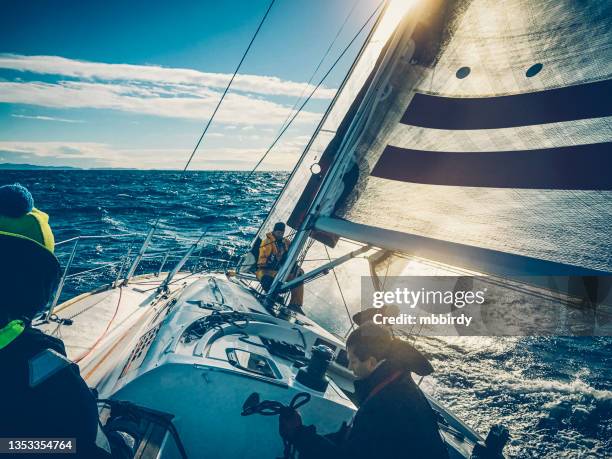 sailing crew on sailboat on regatta on sunny autumn morning - cruise crew stock pictures, royalty-free photos & images