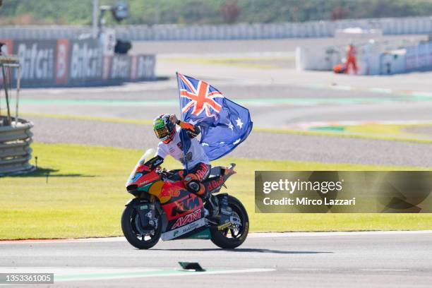 Remy Gardner of Australia and Red Bull KTM Ajo celebrates with the flag the Moto2 World Champion on track during the MotoGP of Comunitat Valenciana:...