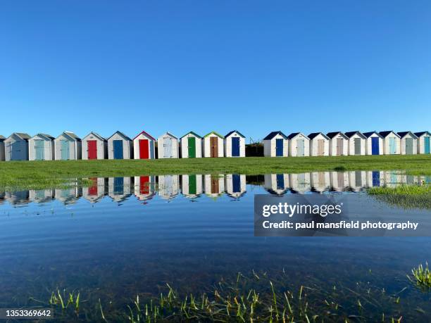 reflection of beach huts - paignton imagens e fotografias de stock