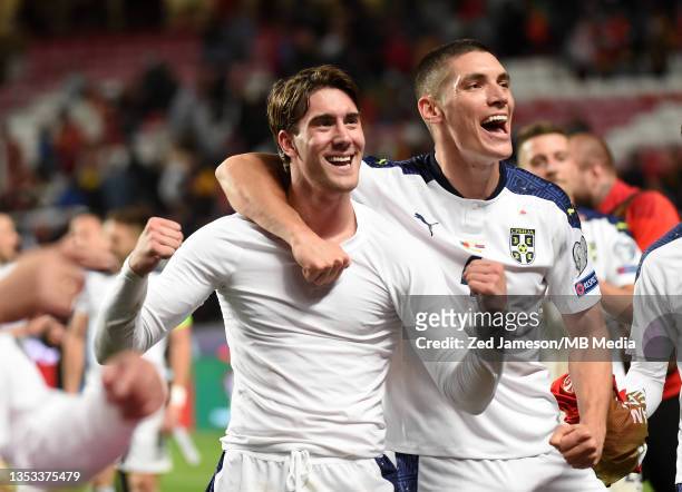 Dusan Vlahovic and Nikola Milenković of Serbia celebrate after winning the match at the 2022 FIFA World Cup Qualifier match between Portugal and...