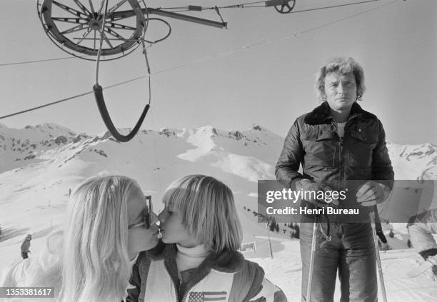 Johnny Hallyday, with his wife Sylvie Vartan and his son David Hallyday on a ski trip, January 1974