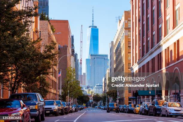 street in west village with one world trade center in the middle, new york city, usa - greenwich village photos et images de collection