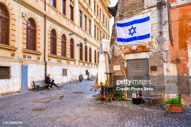 a jewish cultural club in the ancient jewish ghetto in the historic heart of rome - ancient roman flag stock pictures, royalty-free photos & images