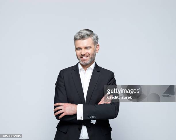 portrait of cheerful mature businessman - grey shirt stock pictures, royalty-free photos & images
