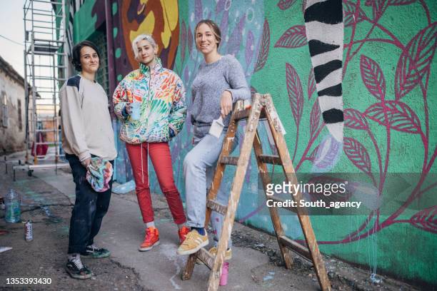 female street artists - mural stock pictures, royalty-free photos & images