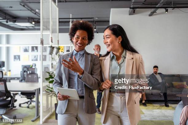 modern and confident multiracial businesswomen, heading to the board meeting - meeting candid office suit stock pictures, royalty-free photos & images