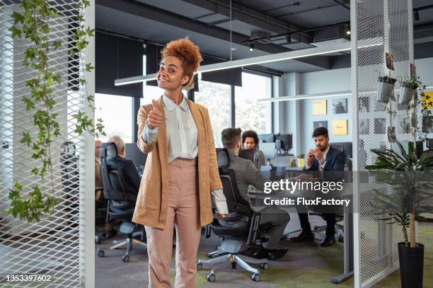 successful and confident mixed-race female lawyer showing an thumb up - account manager stock pictures, royalty-free photos & images