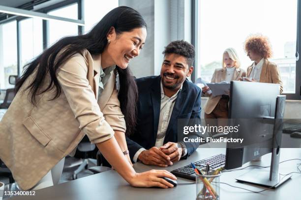 cheerful multiracial male and female business persons, talking in the office - account manager stock pictures, royalty-free photos & images