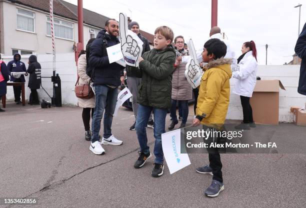 Fans arrive prior to the Barclays FA Women's Super League match between West Ham United Women and Reading Women at Chigwell Construction Stadium on...