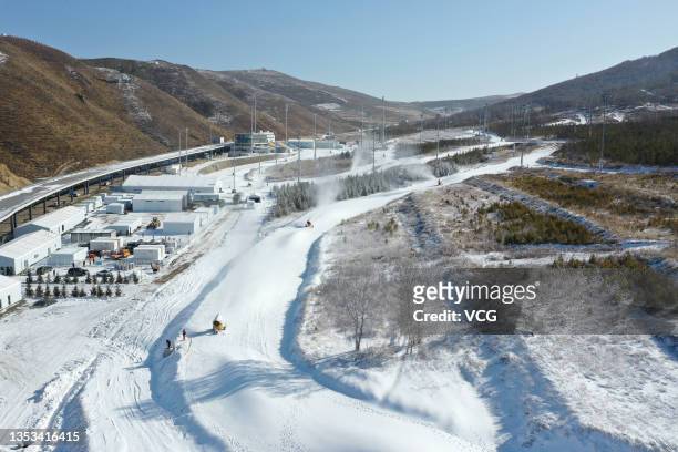 Snowmaking machines work at the National Cross-Country Skiing Centre, a venue for the cross-country skiing and Nordic combined events of Beijing 2022...