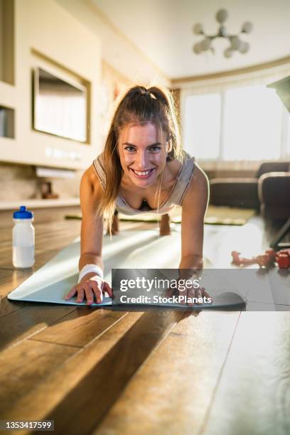 happy woman in plank position - plank position stock pictures, royalty-free photos & images